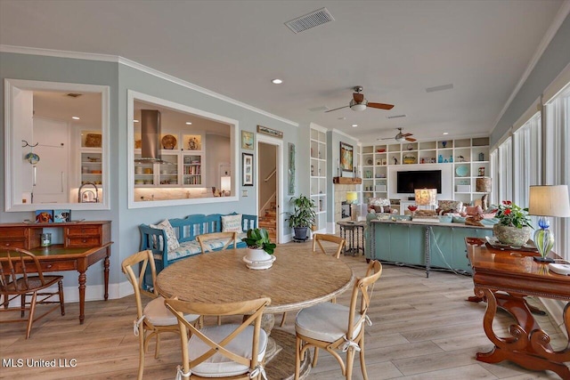 205 Audubon Point Dr, Brandon, MS 39047 - dining space with ceiling fan, ornamental molding, built in shelves, and visible vents