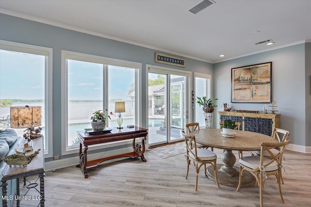 205 Audubon Point Dr, Brandon, MS 39047 - dining space with crown molding, visible vents, and light wood-style flooring