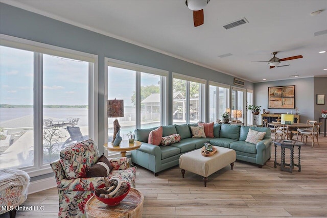 205 Audubon Point Dr, Brandon, MS 39047 - living room featuring visible vents, a ceiling fan, plenty of natural light, and crown molding