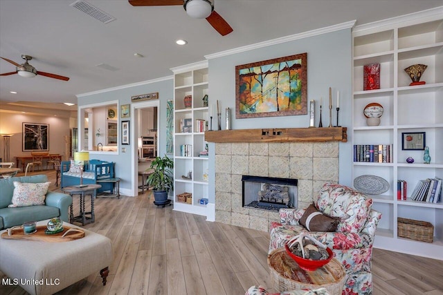 205 Audubon Point Dr, Brandon, MS 39047 - living area with crown molding, a ceiling fan, visible vents, and wood finished floors