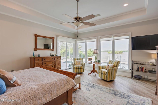 205 Audubon Point Dr, Brandon, MS 39047 - bedroom with ornamental molding, access to exterior, multiple windows, light wood-type flooring, and a raised ceiling