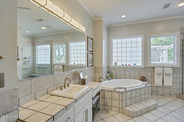 205 Audubon Point Dr, Brandon, MS 39047 - full bathroom featuring vanity, tile patterned floors, ornamental molding, tiled shower, and a bath