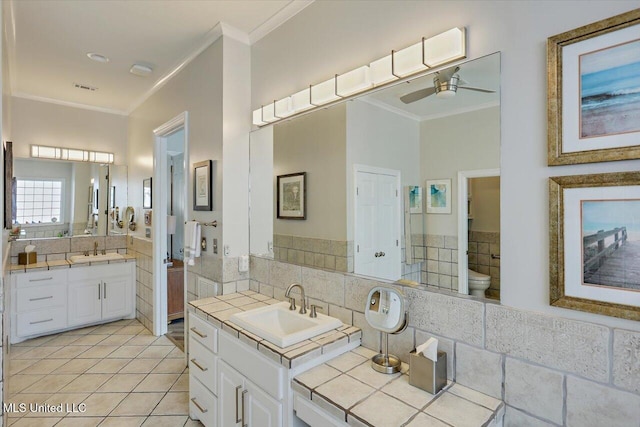205 Audubon Point Dr, Brandon, MS 39047 - bathroom featuring a ceiling fan, ornamental molding, a sink, and two vanities