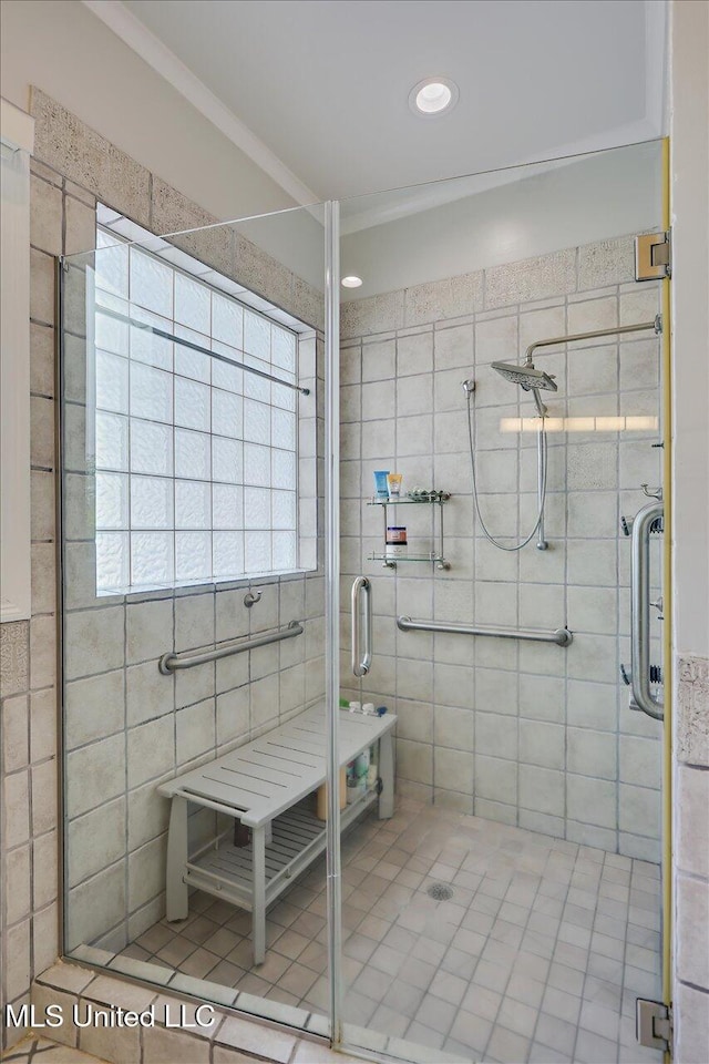 205 Audubon Point Dr, Brandon, MS 39047 - full bath featuring crown molding, tile walls, and a shower stall