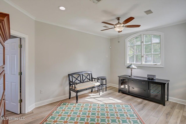 205 Audubon Point Dr, Brandon, MS 39047 - living area featuring crown molding, baseboards, ceiling fan, and wood finished floors