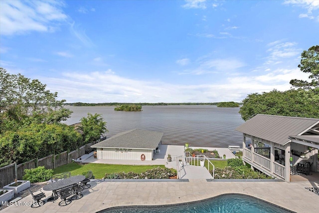 205 Audubon Point Dr, Brandon, MS 39047 - view of swimming pool with a fenced backyard, a fenced in pool, a water view, a lawn, and a patio