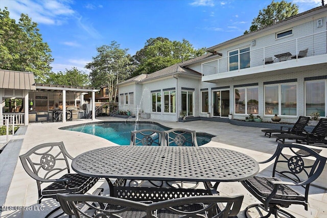 205 Audubon Point Dr, Brandon, MS 39047 - pool featuring outdoor dining area and a patio