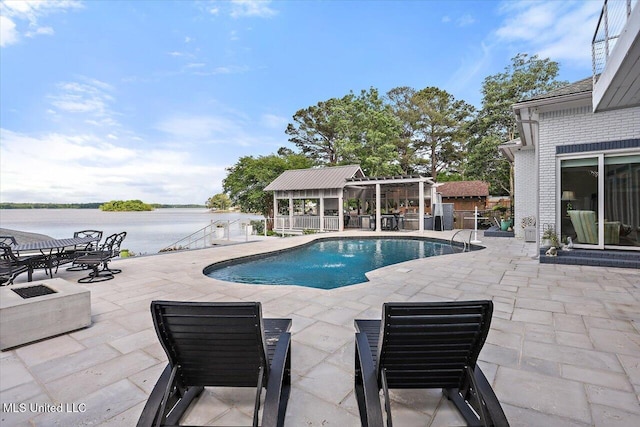 205 Audubon Point Dr, Brandon, MS 39047 - pool featuring an outdoor structure, a water view, and a patio area