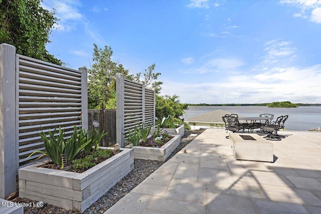 205 Audubon Point Dr, Brandon, MS 39047 - view of patio / terrace featuring a water view, fence, and outdoor dining space