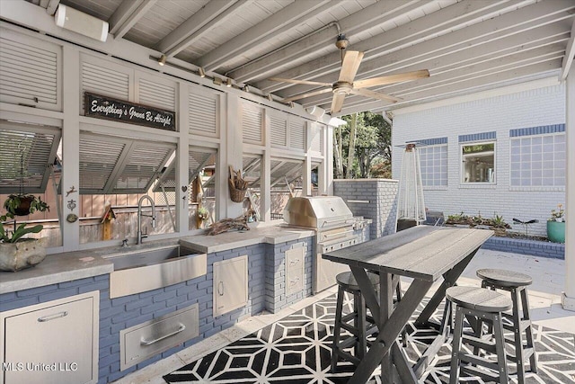 205 Audubon Point Dr, Brandon, MS 39047 - view of patio featuring a ceiling fan, exterior kitchen, a sink, and outdoor dining space
