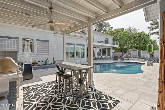 205 Audubon Point Dr, Brandon, MS 39047 - pool with grilling area, ceiling fan, exterior kitchen, fence, and a patio