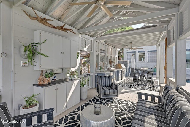 205 Audubon Point Dr, Brandon, MS 39047 - sunroom with beamed ceiling and a ceiling fan