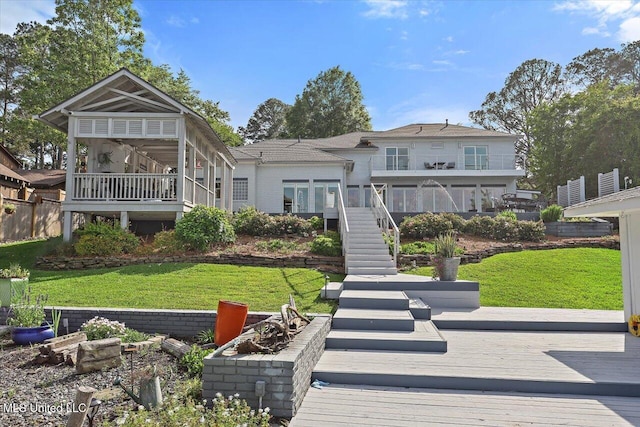 205 Audubon Point Dr, Brandon, MS 39047 - back of property with a lawn, stairs, and a deck