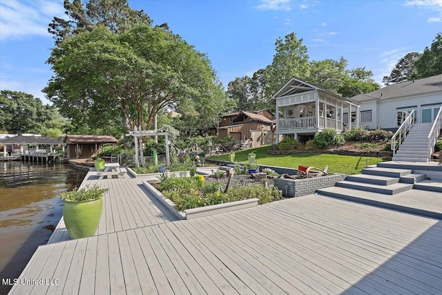 205 Audubon Point Dr, Brandon, MS 39047 - dock area featuring stairs, a yard, and a deck with water view