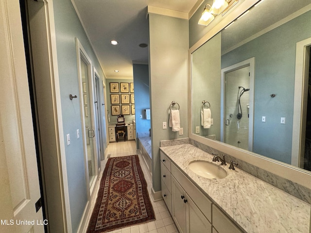 bathroom featuring vanity, tile patterned floors, ornamental molding, and an enclosed shower