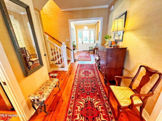 hall featuring crown molding and wood-type flooring