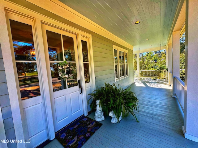 wooden terrace with a porch