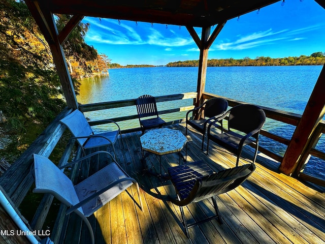 deck featuring a water view