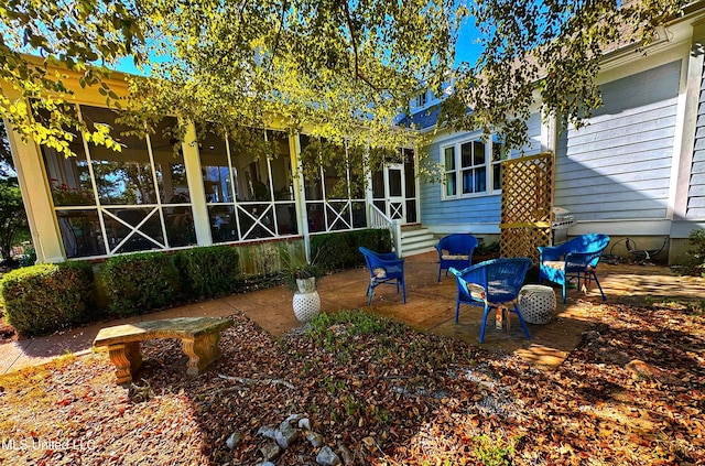 back of property with a patio