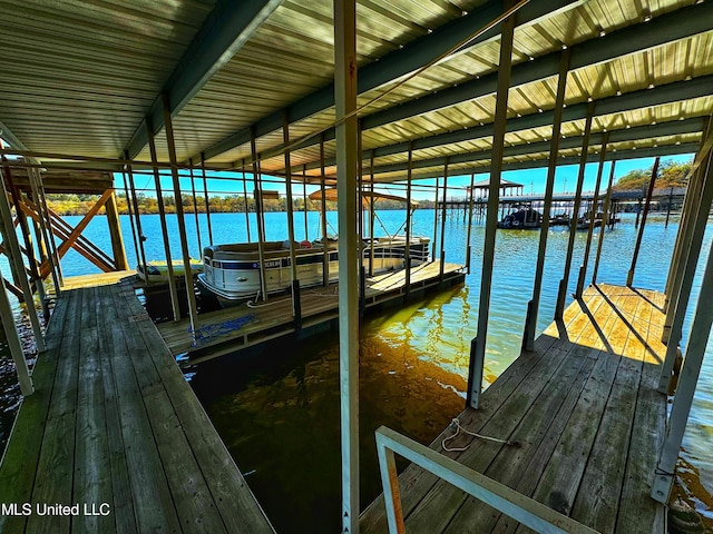 dock area featuring a water view