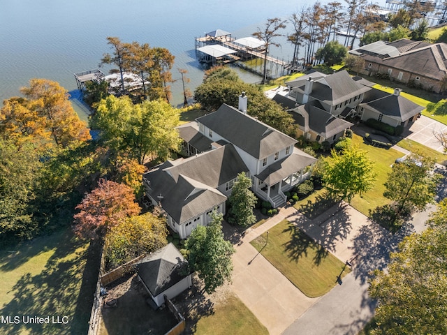 aerial perspective of suburban area with a large body of water