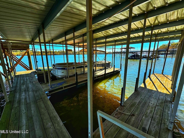 dock featuring a water view and boat lift