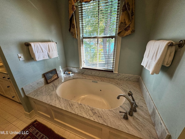 bathroom with a bathing tub and tile patterned floors