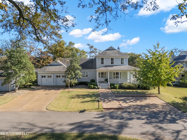 view of front of property featuring concrete driveway, covered porch, roof with shingles, a garage, and a front yard