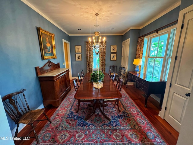dining space with a chandelier, dark wood finished floors, baseboards, and ornamental molding