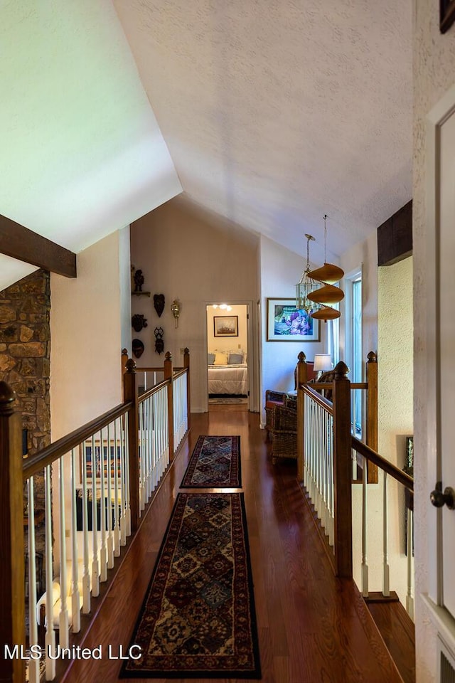 144 Gum Branch To Highway 25 Road, Louisville, MS 39339 - hall featuring an upstairs landing, lofted ceiling, wood finished floors, and a chandelier