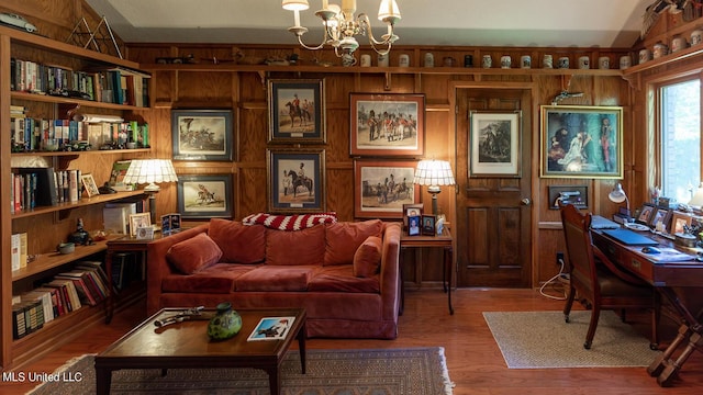 144 Gum Branch To Highway 25 Road, Louisville, MS 39339 - living room with a chandelier, wooden walls, wood finished floors, and a desk