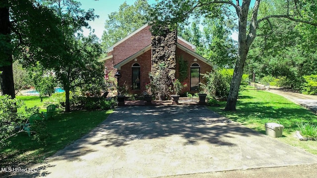 144 Gum Branch To Highway 25 Road, Louisville, MS 39339 - view of front of property with brick siding, a front yard, and driveway