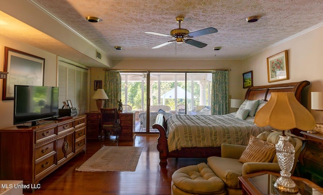 144 Gum Branch To Highway 25 Road, Louisville, MS 39339 - bedroom with access to outside, dark wood-style flooring, a textured ceiling, and ornamental molding