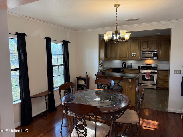 dining room with ornamental molding, dark wood-type flooring, a wealth of natural light, and an inviting chandelier