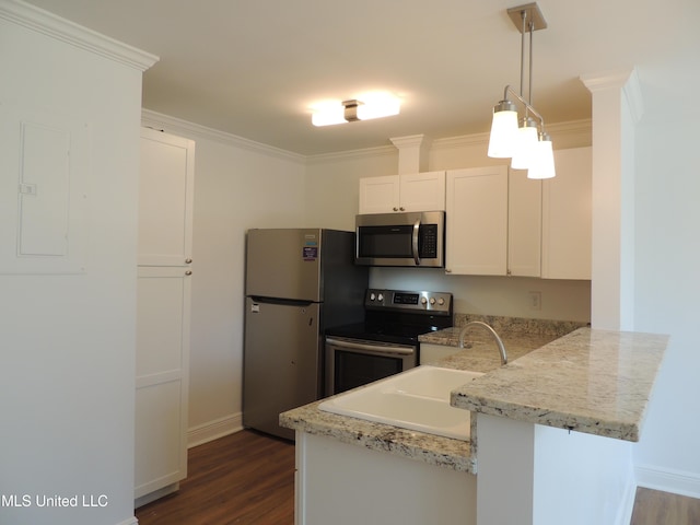 kitchen featuring a peninsula, white cabinetry, ornamental molding, appliances with stainless steel finishes, and electric panel