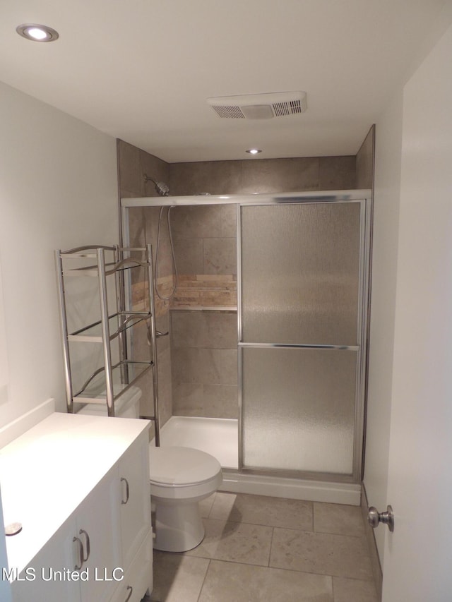 full bath featuring a stall shower, visible vents, toilet, tile patterned flooring, and vanity