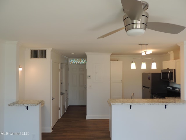 kitchen featuring ornamental molding, appliances with stainless steel finishes, dark wood-style floors, and visible vents