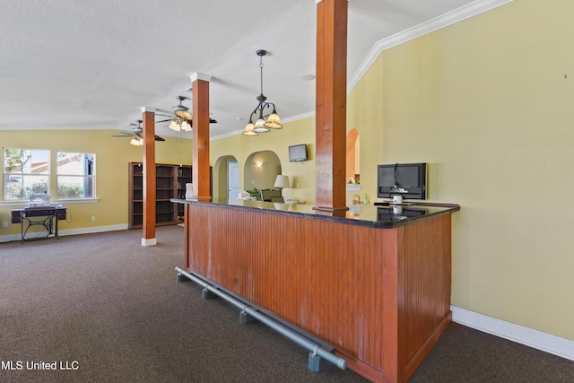 welcome area with a ceiling fan and arched walkways