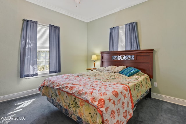 bedroom with carpet, multiple windows, and baseboards