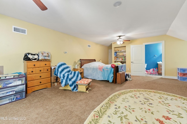 bedroom featuring carpet floors, visible vents, a ceiling fan, and lofted ceiling