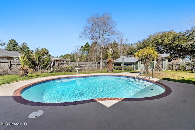 view of swimming pool with a fenced backyard, a fenced in pool, and a patio