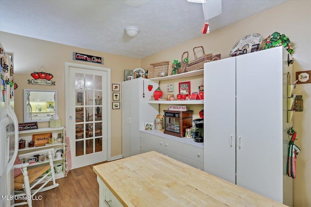 727 Laney Dr, Clinton, MS 39056 - kitchen featuring wood finished floors, a textured ceiling, and butcher block countertops