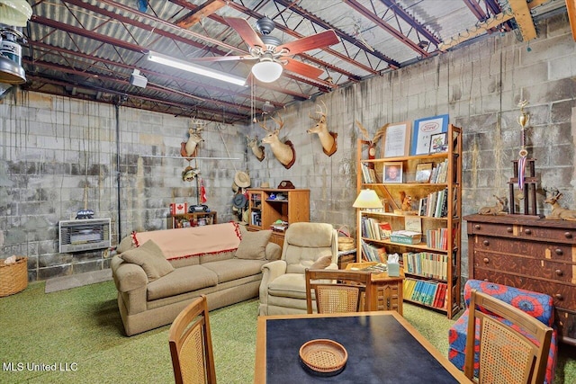 727 Laney Dr, Clinton, MS 39056 - living area featuring ceiling fan, heating unit, concrete block wall, and carpet flooring