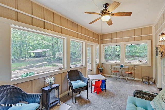 727 Laney Dr, Clinton, MS 39056 - sunroom / solarium with ceiling fan, a wood stove, carpet floors, baseboards, and crown molding