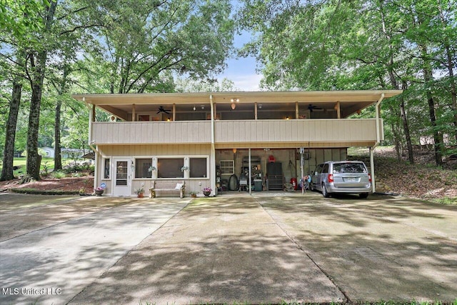 727 Laney Dr, Clinton, MS 39056 - view of front of house featuring ceiling fan, a balcony, and driveway