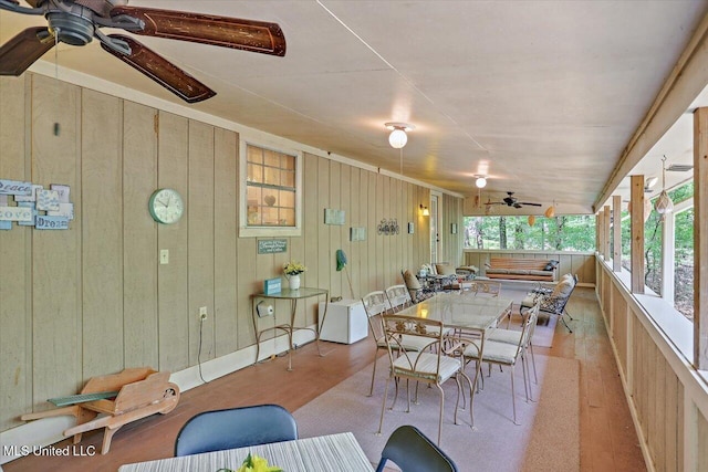 727 Laney Dr, Clinton, MS 39056 - dining area with a ceiling fan, wood finished floors, and wood walls
