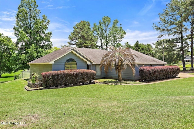 ranch-style home with a front lawn