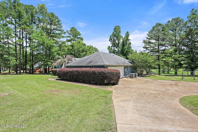 view of home's exterior with a lawn and cooling unit