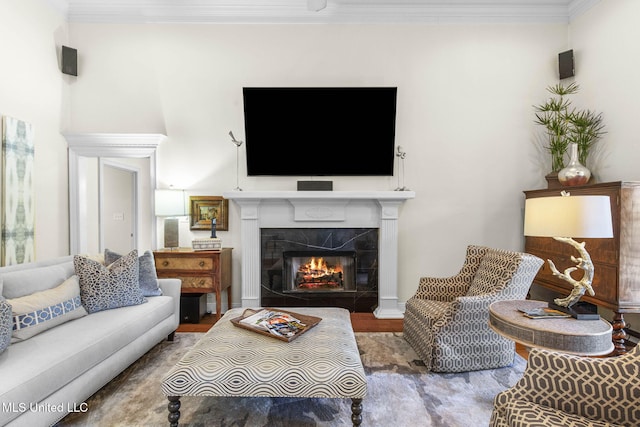 141 Whisper Lake Blvd, Madison, MS 39110 - living room with a glass covered fireplace, wood finished floors, and ornamental molding