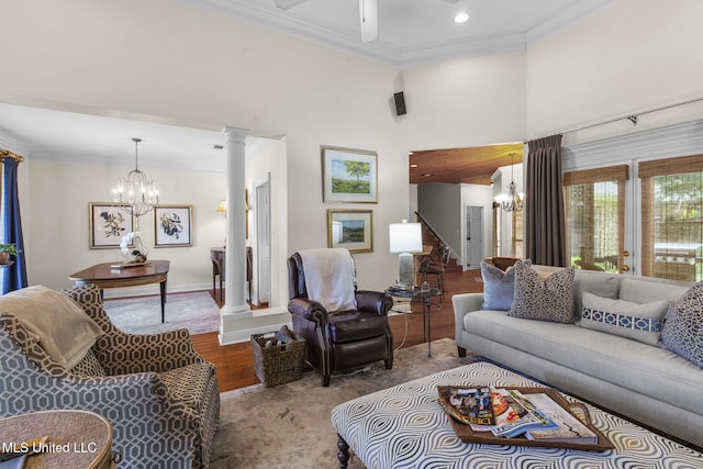 141 Whisper Lake Blvd, Madison, MS 39110 - living room with decorative columns, a chandelier, ornamental molding, ceiling fan, and wood finished floors